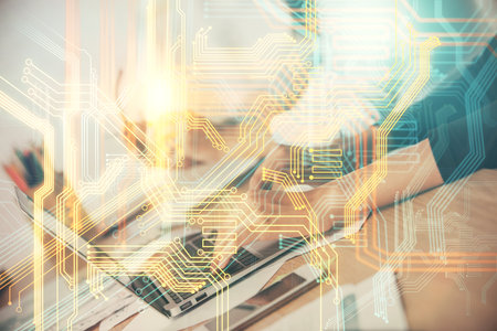 Double exposure of woman hands working on computer and world map hologram drawing. International technology business concept.の写真素材