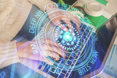 Double exposure of woman hands working on computer and data theme hologram drawing. Tech concept.の写真素材