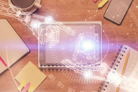 Double exposure of technology theme drawing over work table desktop. Top view. Global data analysis...