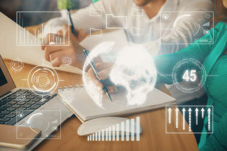 Double exposure of forex chart drawing over people taking notes background. Concept of financial analysisの写真素材