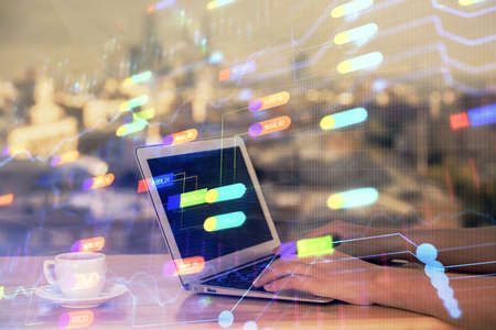 Multi exposure of woman hands working on computer and data theme hologram drawing. Tech concept.