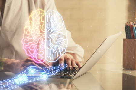 Double exposure of woman hands working on computer and brain hologram drawing. Ai concept.