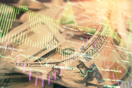 Double exposure of forex graph drawing over us dollars bill background. Concept of financial...
