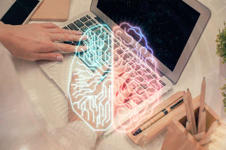 Multi exposure of woman hands working on computer and brain hologram drawing. Ai concept.