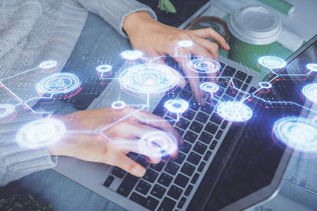 Double exposure of woman hands typing on computer and social network theme hologram drawing. People media concept.の写真素材