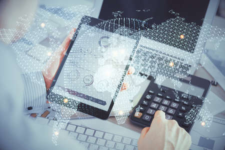 Double exposure of mans hands holding and using a phone and international business theme drawing.の写真素材