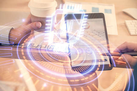 Multi exposure of mans hands holding and using a digital device and data theme drawing. Innovation...