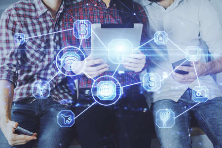 Double exposure of social network theme drawing and man and woman working together holding and using...