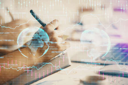 Double exposure of forex graph drawing over people taking notes background. Concept of financial...