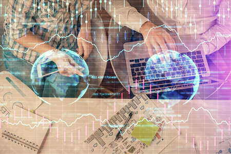 Multi exposure of man and woman working together and forex graph hologram drawing. Financial...