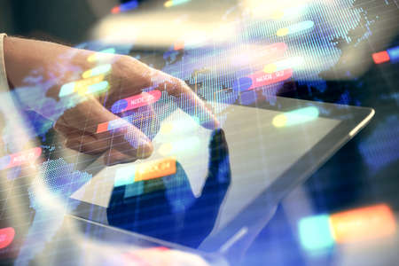 Multi exposure of mans hand holding and using a digital device and data theme drawing. Innovation concept.の写真素材