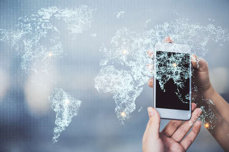 Double exposure of social network sketch hologram and woman holding and using a mobile device.の写真素材