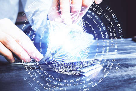 Multi exposure of fingerprint drawing hologram and USA dollars bills and man hands. security concept.の写真素材