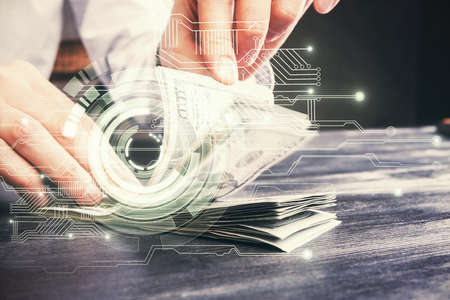 Double exposure of technology drawing hologram and us dollars bills and man hands. Data conceptの写真素材