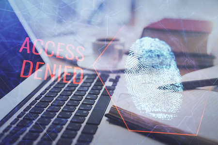 Double exposure of fingerprint drawing and desktop with coffee and items on table background. Concept of security.の写真素材