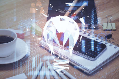 Double exposure of bulb drawing and cell phone background. Concept of ideaの写真素材