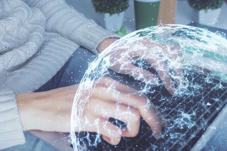 Double exposure of woman hands typing on computer and social network theme hologram drawing. People media concept.の写真素材