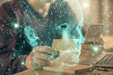Double exposure of mans hand holding and using a digital device and brain hologram drawing. Data concept.の写真素材