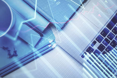Double exposure of forex graph drawing over desktop background with computer. Concept of financial...