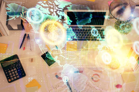 Double exposure of forex chart drawing over table background with computer. Concept of financial...