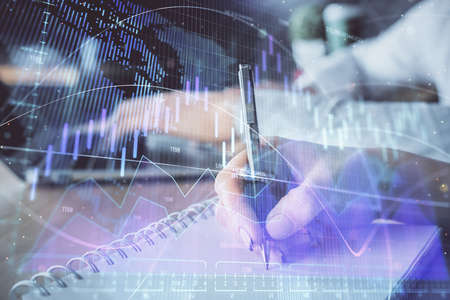 Double exposure of forex chart drawing over people taking notes background. Concept of financial...