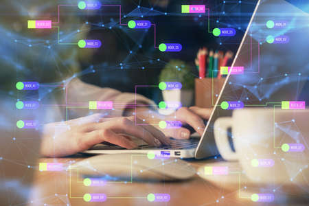 Double exposure of woman hands working on computer and data theme hologram drawing. Tech concept.