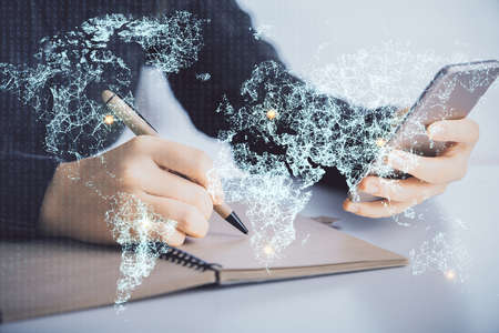 Double exposure of social network sketch hologram and woman holding and using a mobile device.の写真素材