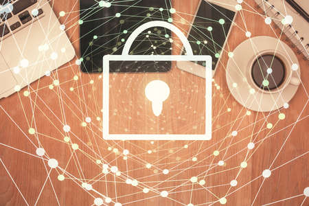 Double exposure of lock drawing over desktop. Top view. Security concept.