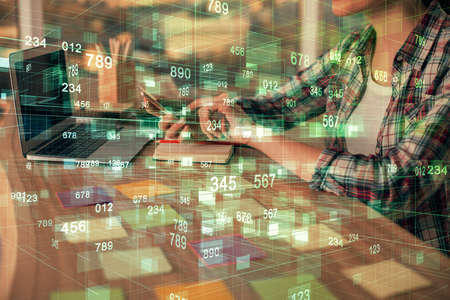 Multi exposure of woman hands working on computer and data theme hologram drawing. Tech concept.の写真素材