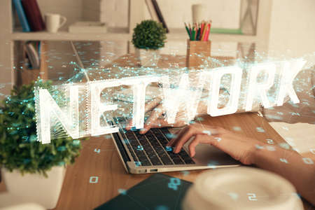 Double exposure of woman hands working on computer and data theme hologram drawing. Tech concept.の写真素材