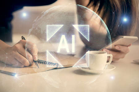 Double exposure of technology sketch hologram and woman holding and using a mobile device.の写真素材