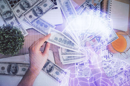 Multi exposure of vr glasses drawing hologram and USA dollars bills and man hands.