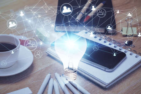 Double exposure of bulb drawing and cell phone background. Concept of idea