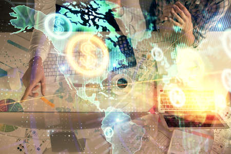 Double exposure of man and woman working together and financial graph hologram drawing. market...