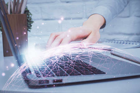 Double exposure of woman hands typing on computer and social network theme hologram drawing. People media concept.の写真素材