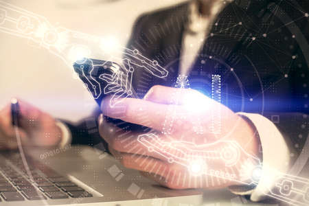 Multi exposure of mans hand holding and using a digital device and data theme drawing. Innovation...