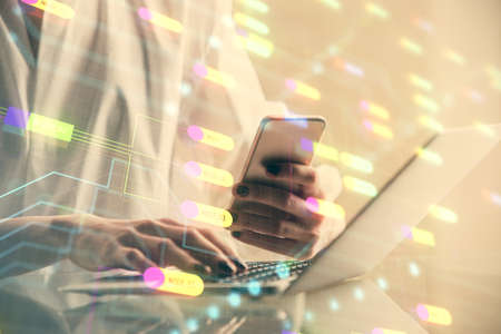 Double exposure of technology sketch hologram and woman holding and using a mobile device. Ai...