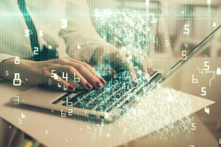 Multi exposure of woman hands working on computer and data theme hologram drawing. Tech concept.の写真素材