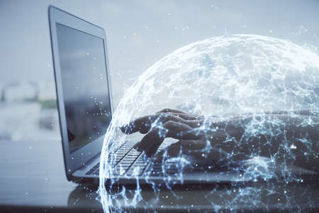 Double exposure of woman hands typing on computer and social network theme hologram drawing. People...