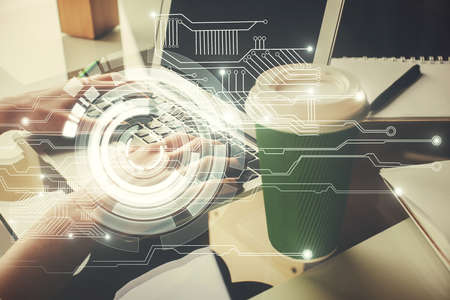 Double exposure of woman hands working on computer and data theme hologram drawing. Tech concept.