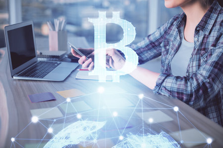 Double exposure of woman hands typing on computer and crypto market theme hologram drawing. Blockchain concept.の写真素材