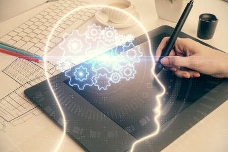 Double exposure of brain sketch hologram and woman holding and using a mobile device.