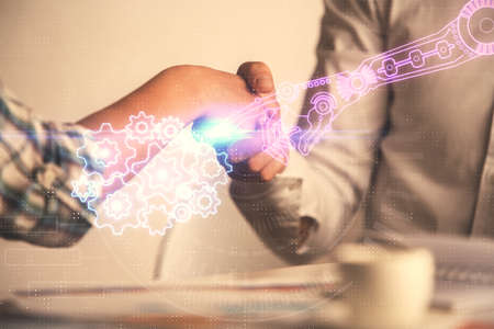 Double exposure of data theme hologram and handshake of two men. Partnership in IT industry concept.