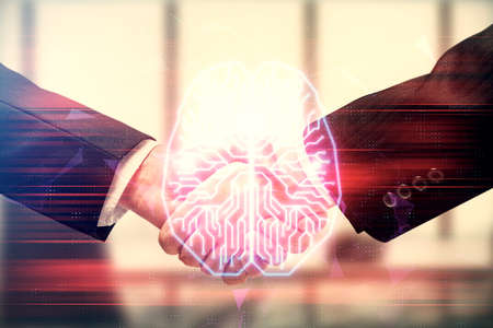 Double exposure of brain hologram and handshake of two men. Partnership in IT industry concept.の写真素材