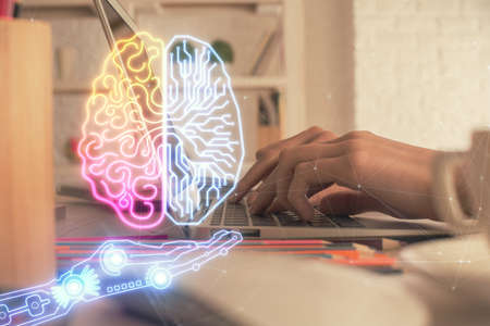 Double exposure of woman hands working on computer and brain hologram drawing. Ai concept.