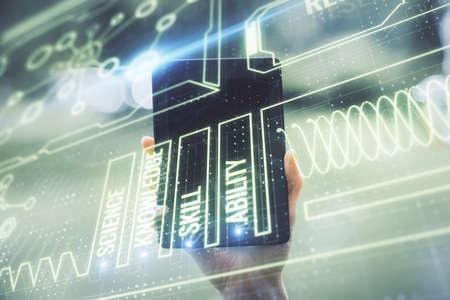 Double exposure of education theme sketch hologram and woman holding and using a mobile device.