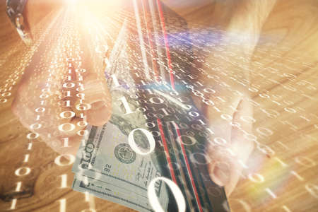 Double exposure of technology drawing hologram and us dollars bills and man hands. Data concept