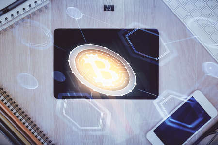 Double exposure of blockchain theme hologram over table with phone. Top view. Crypto technology concept.の写真素材