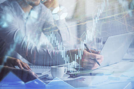 Multi exposure of man and woman working together and financial chart hologram. Business concept....