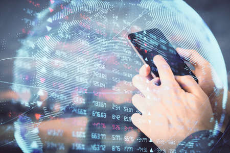 Double exposure of mans hands holding and using a phone and international business theme drawing.